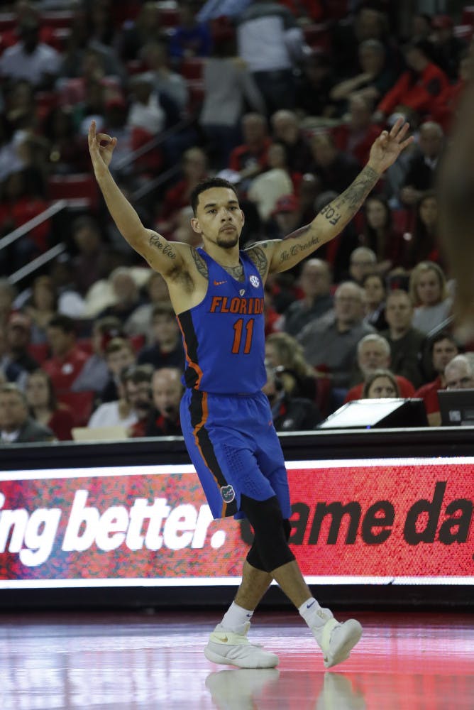 Florida guard Chris Chiozza (11) reacts after hitting a 3-point shot during the second half of the team's NCAA college basketball game against Georgia on Tuesday, Feb. 7, 2017, in Athens, Ga. Florida won 72-60. (AP Photo/John Bazemore)