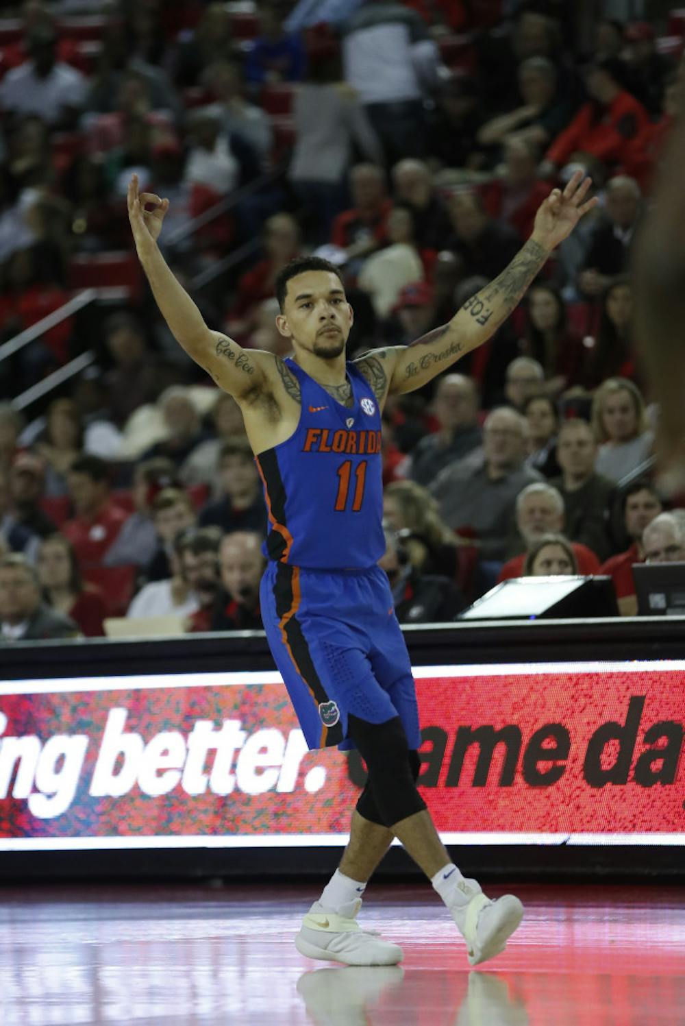 <p>Florida guard Chris Chiozza (11) reacts after hitting a 3-point shot during the second half of the team's NCAA college basketball game against Georgia on Tuesday, Feb. 7, 2017, in Athens, Ga. Florida won 72-60. (AP Photo/John Bazemore)</p>