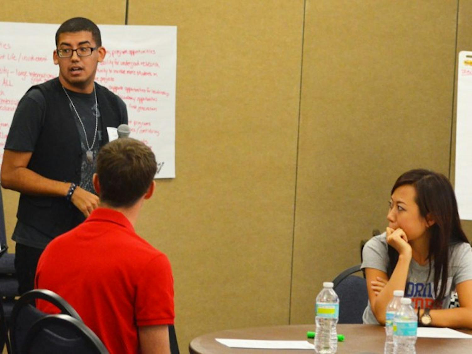 Juan Rodriguez, Student Senate treasurer, discusses UF’s strengths and qualities with other students during a forum on the presidential search