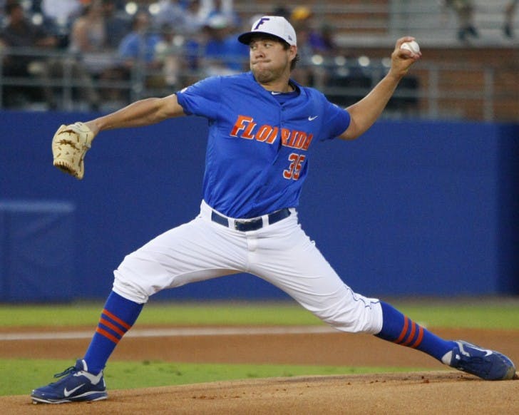 Florida starting pitcher Brian Johnson throws against LSU on April 5. Johnson started Sunday’s game, throwing six scoreless innings while also driving in three runs at the plate. UF won 8-1.&nbsp;