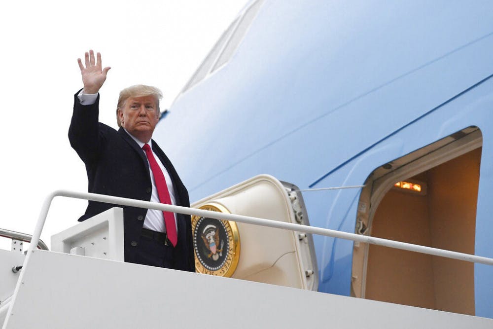 President Donald Trump waves from the top of the steps of Air Force One at Andrews Air Force Base in Md., Friday, Jan. 31, 2020. (AP Photo/Susan Walsh)