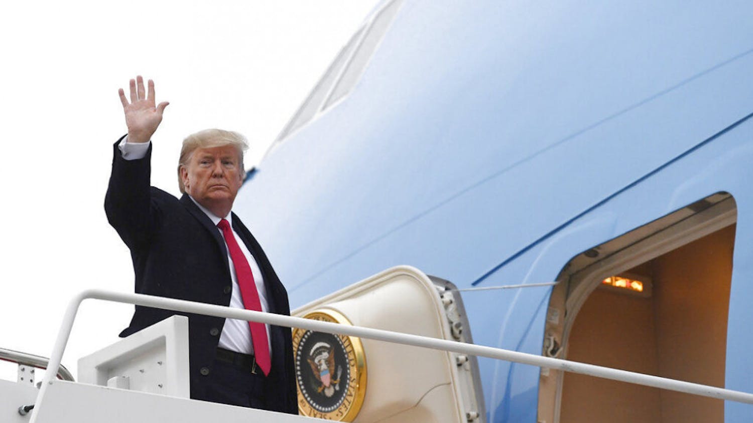 President Donald Trump waves from the top of the steps of Air Force One at Andrews Air Force Base in Md., Friday, Jan. 31, 2020. (AP Photo/Susan Walsh)