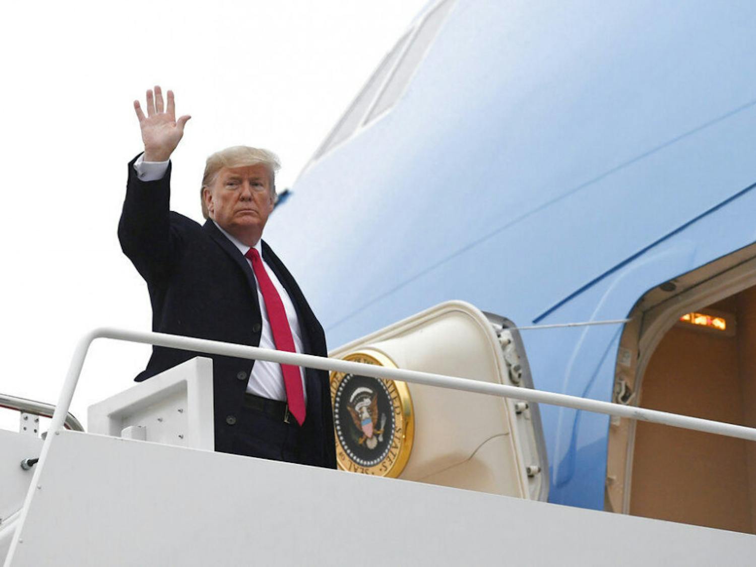 President Donald Trump waves from the top of the steps of Air Force One at Andrews Air Force Base in Md., Friday, Jan. 31, 2020. (AP Photo/Susan Walsh)