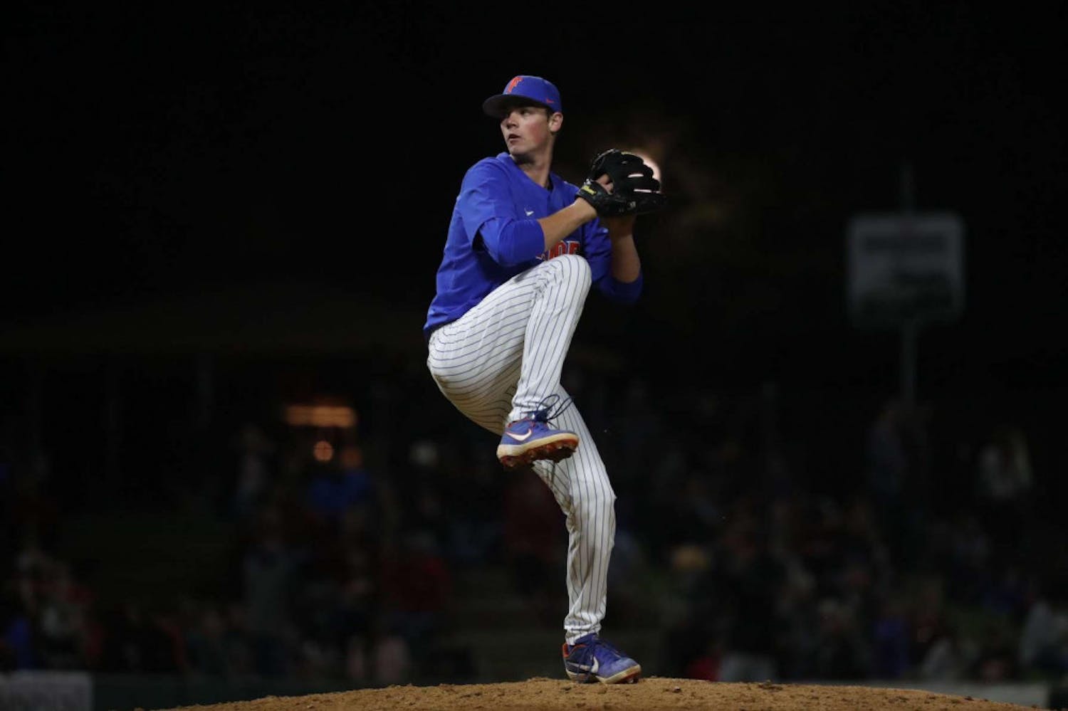 Hunter Barco, a 19-year-old UF business administration freshman, pitches in an exhibition game against Georgia. Barco allowed four runs in a 5-2 loss to the Hurricanes.
