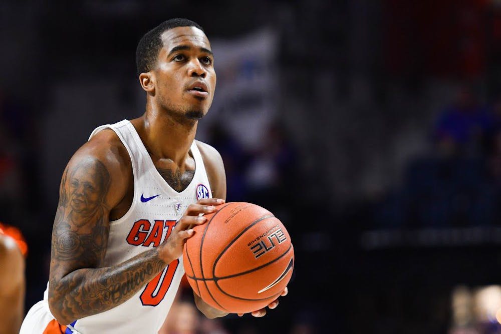 <p>UF guard Kasey Hill shoots a free throw during Florida's 94-71 win over the University of Arkansas at Little Rock on Dec. 21, 2016, at the O'Connell Center.&nbsp;</p>