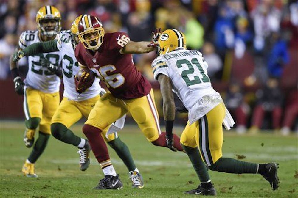 <p>Washington Redskins tight end Jordan Reed (86) pushes back Green Bay Packers free safety Ha Ha Clinton-Dix (21) during the first half of an NFL wild card playoff football game in Landover, Md., Sunday, Jan. 10, 2016. (AP Photo/Nick Wass)</p>