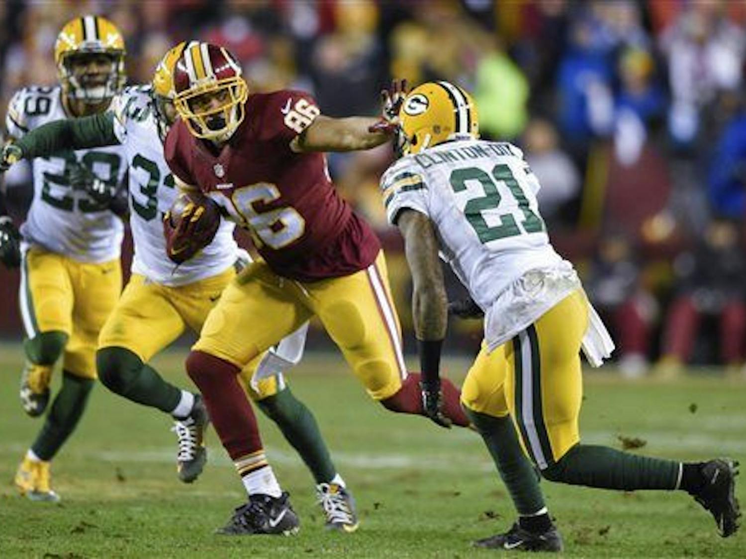 Washington Redskins tight end Jordan Reed (86) pushes back Green Bay Packers free safety Ha Ha Clinton-Dix (21) during the first half of an NFL wild card playoff football game in Landover, Md., Sunday, Jan. 10, 2016. (AP Photo/Nick Wass)