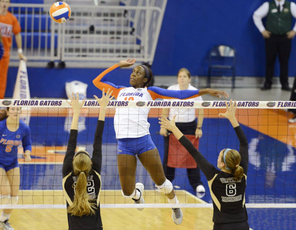 <p>Chloe Mann jumps to spike the ball during Florida’s four-set victory against Western Michigan in the O’Connell Center on Sept. 14</p>