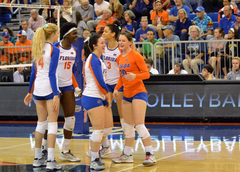 UF players celebrate during Florida's 3-0 win against Alabama State in the first round of the NCAA Tournament in the O'Connell Center.