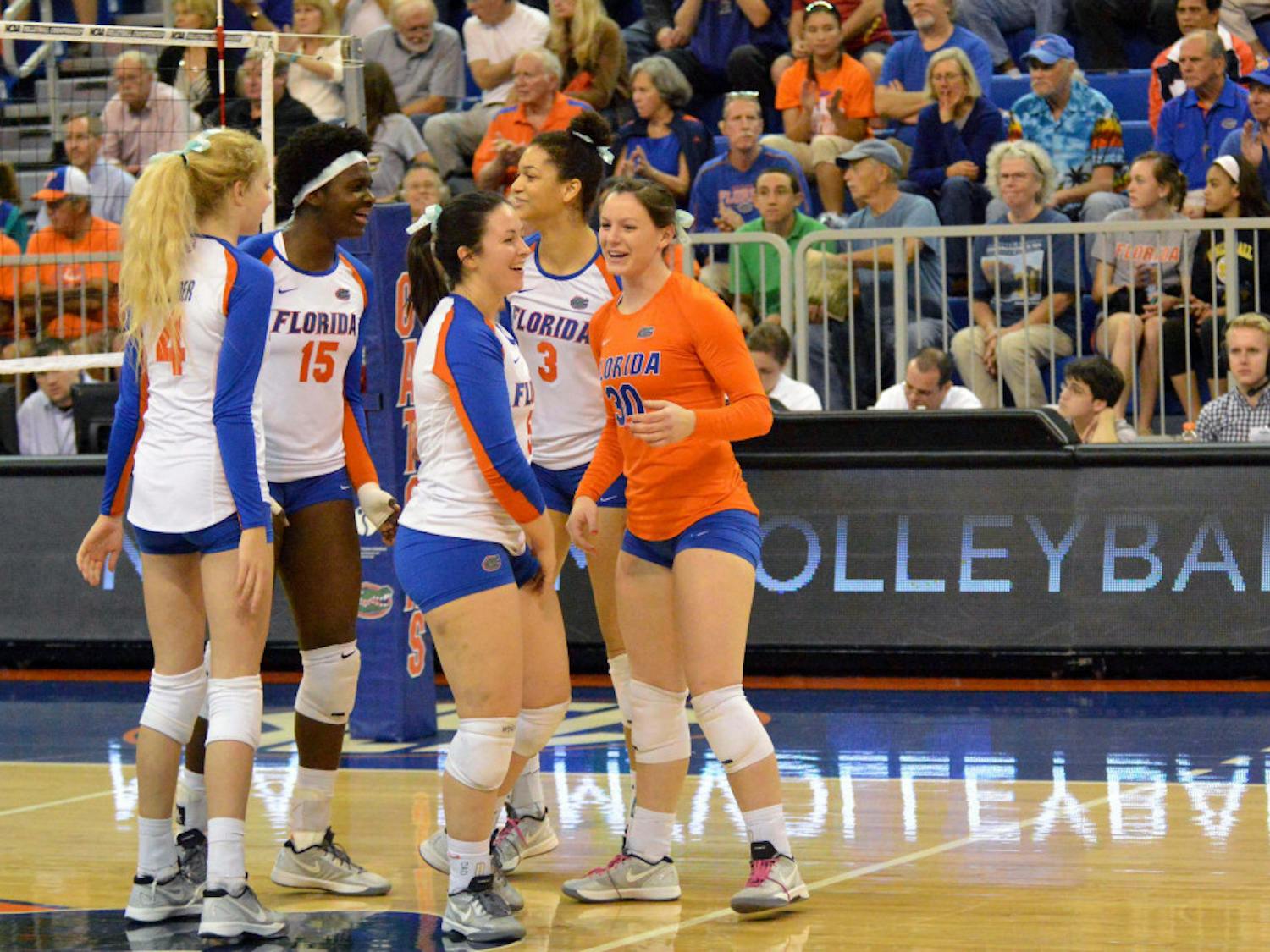 UF players celebrate during Florida's 3-0 win against Alabama State in the first round of the NCAA Tournament in the O'Connell Center.