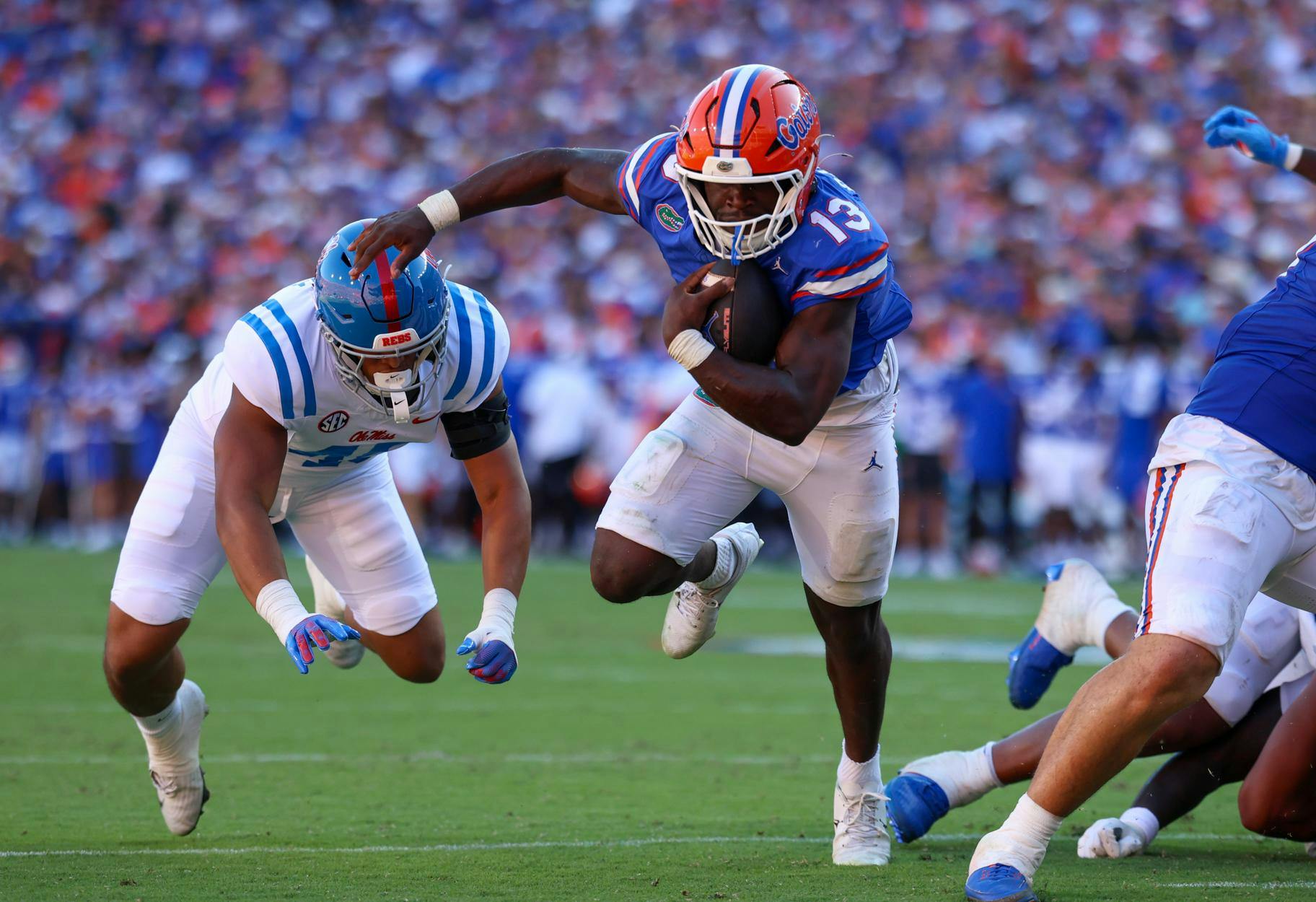 Florida running back Jadan Baugh (13) runs in for a touchdown during an NCAA college football game against Ole Miss, Saturday, Sept. 26, 2026, in Gainesville, Fla.