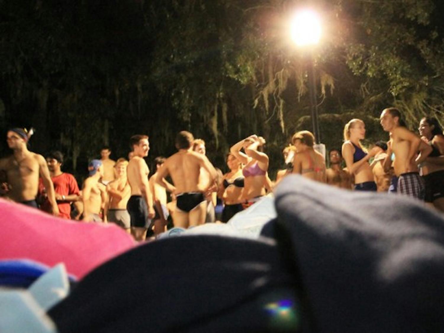 Participants in the Fall 2012 Underwear Dash strip off their clothes, which will be donated to St. Francis House, a Gainesville homeless shelter and soup kitchen. About 24 trash bags of clothing were donated.