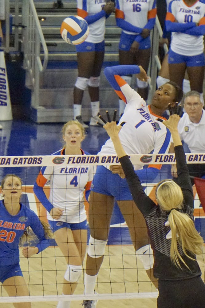Rhamat Alhassan swings for a kill attempt during Florida's 3-0 win against Texas A&amp;M on Oct. 9, 2015, in the O'Connell Center