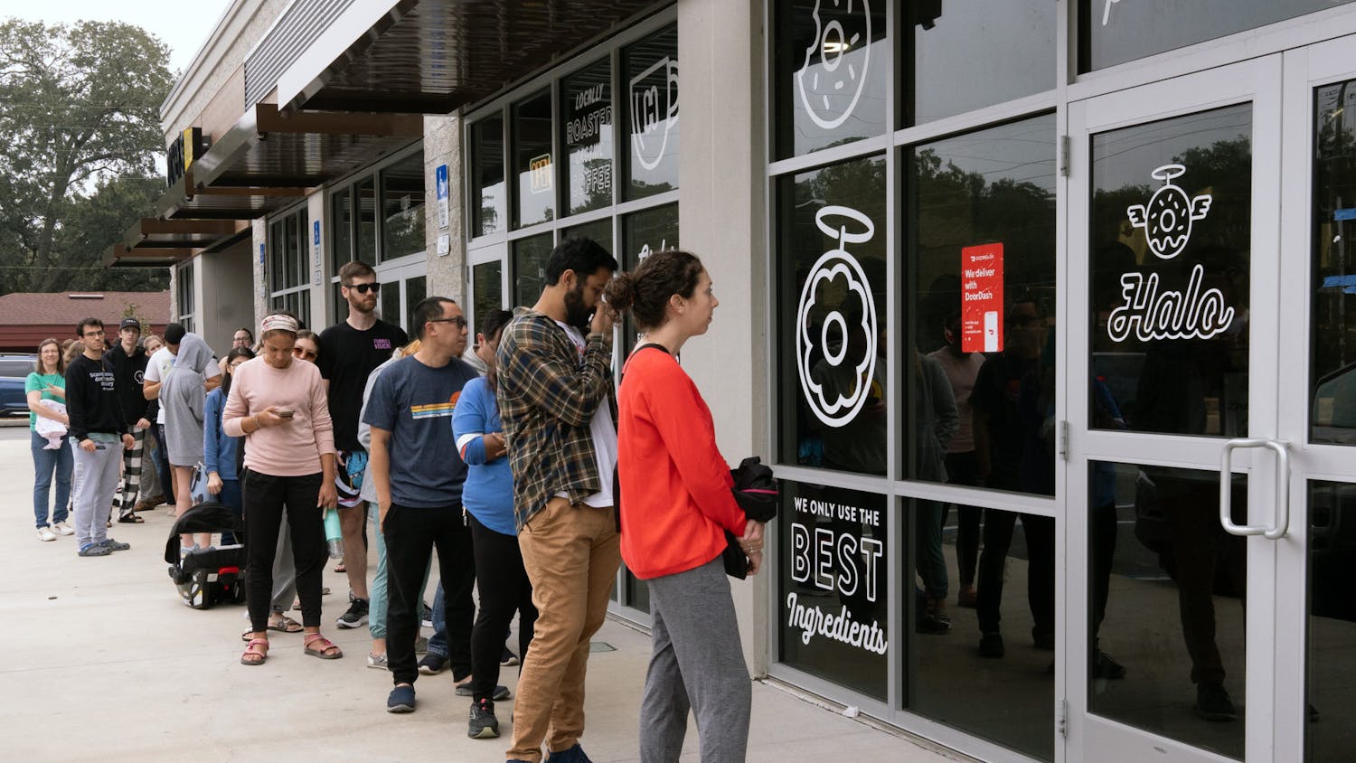Halo customers wait in a line outside the store on Tower Road to get the last potato donuts on Saturday, Dec. 2, 2023.