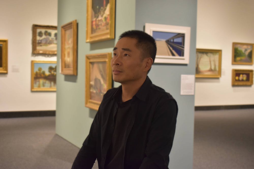 <p>Tingquan Zhang, an artist, is seen at the Harn Museum of Art on Monday, November 14, 2022.<br/><br/></p>