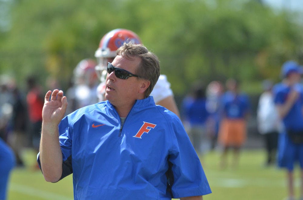 <p>Coach Jim McElwain calls out a play during Spring practice.</p>