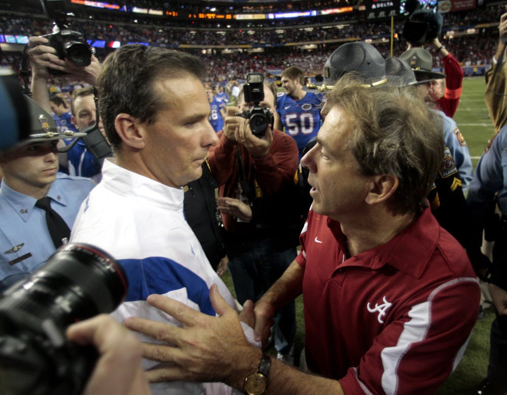 <p>In this Dec. 6, 2008, file photo, Florida coach Urban Meyer, left, and Alabama coach Nick Saban shake hands after Florida defeated Alabama 31-20 in the Southeastern Conference Championship NCAA college football game at the Georgia Dome in Atlanta. Saban's top-seeded Alabama Crimson Tide (12-1) faces Meyer's fourth-seeded Ohio State Buckeyes (12-1) on New Year's Day, a semifinal matchup between two of the most storied programs in the game’s history. There’s history between the two, most notably at two classic SEC championship games.</p>