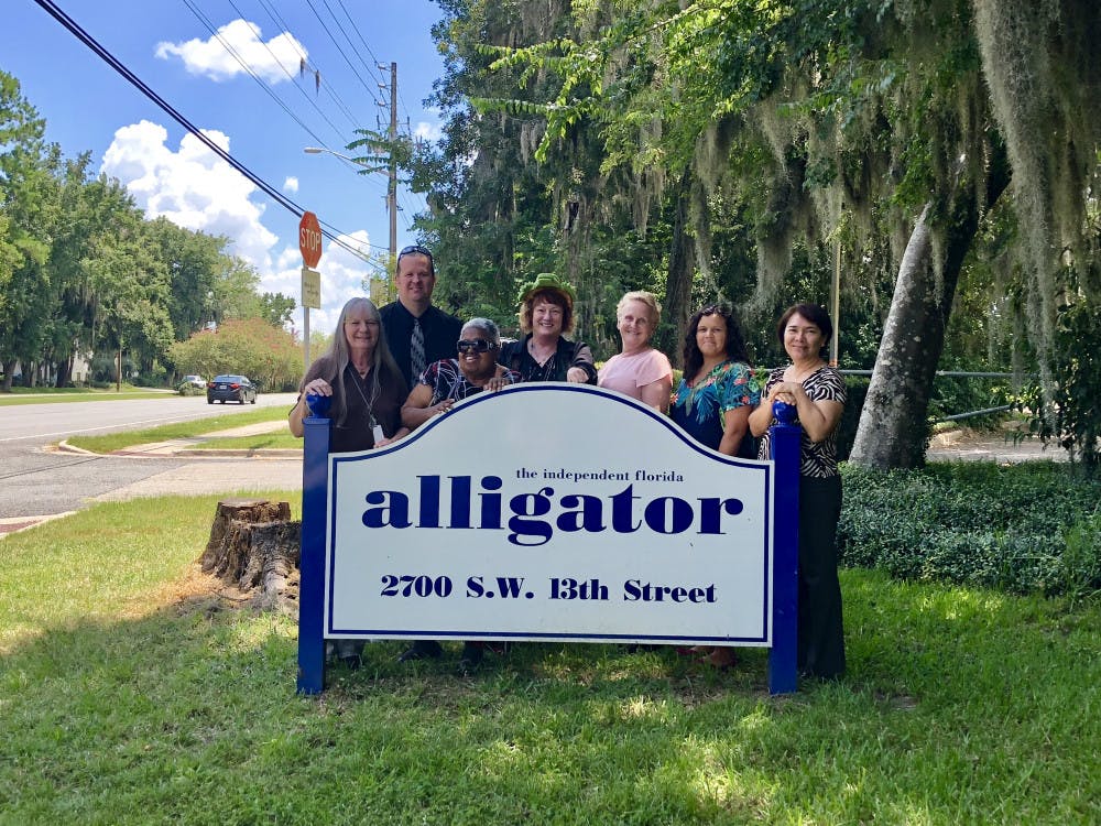 Patricia Carey (center) is resigning from The Alligator on Jan. 1, 2019.