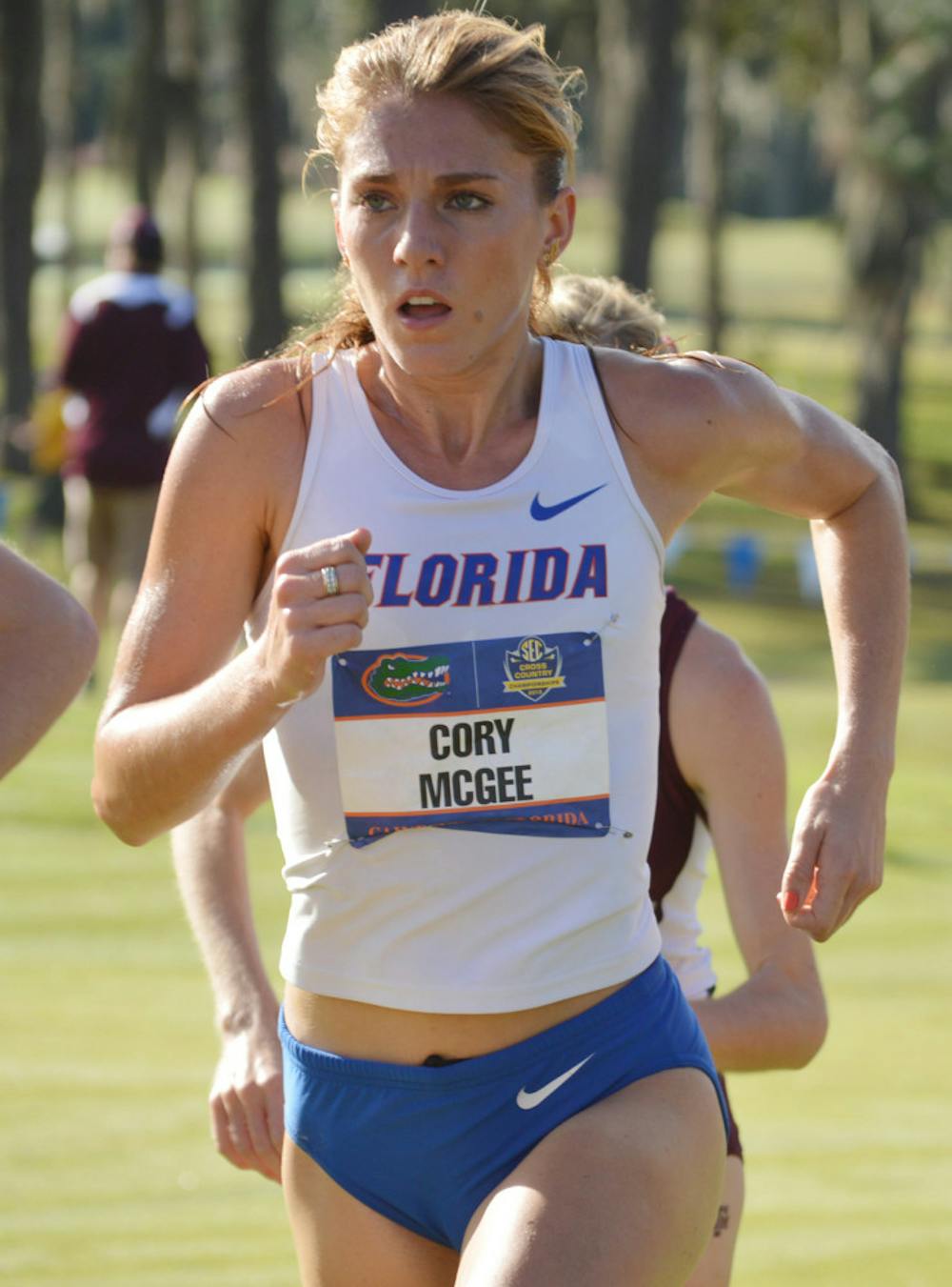 <p>Cory McGee runs in the Southeastern Conference Cross Country Championships on the Mark Bostick Golf Course on Nov. 1, 2013. McGee won her first event of the 2014 track and field season on Jan. 11.</p>