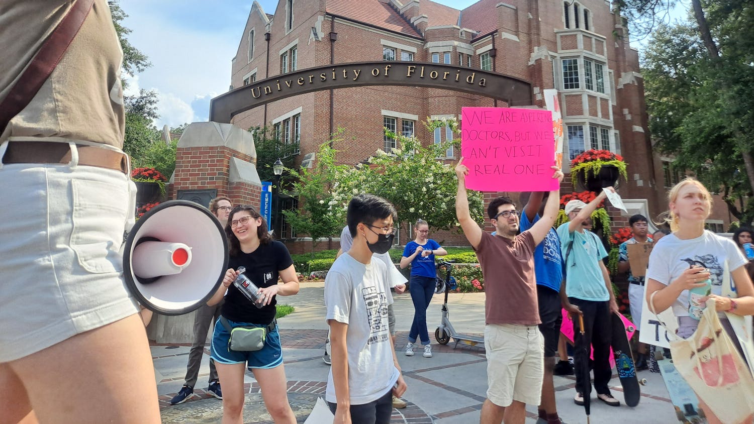 About 50 graduate students marched from the Reitz Union to Tigert Hall Tuesday to protest the proposed increase to graduate assistants&#x27; wages. 