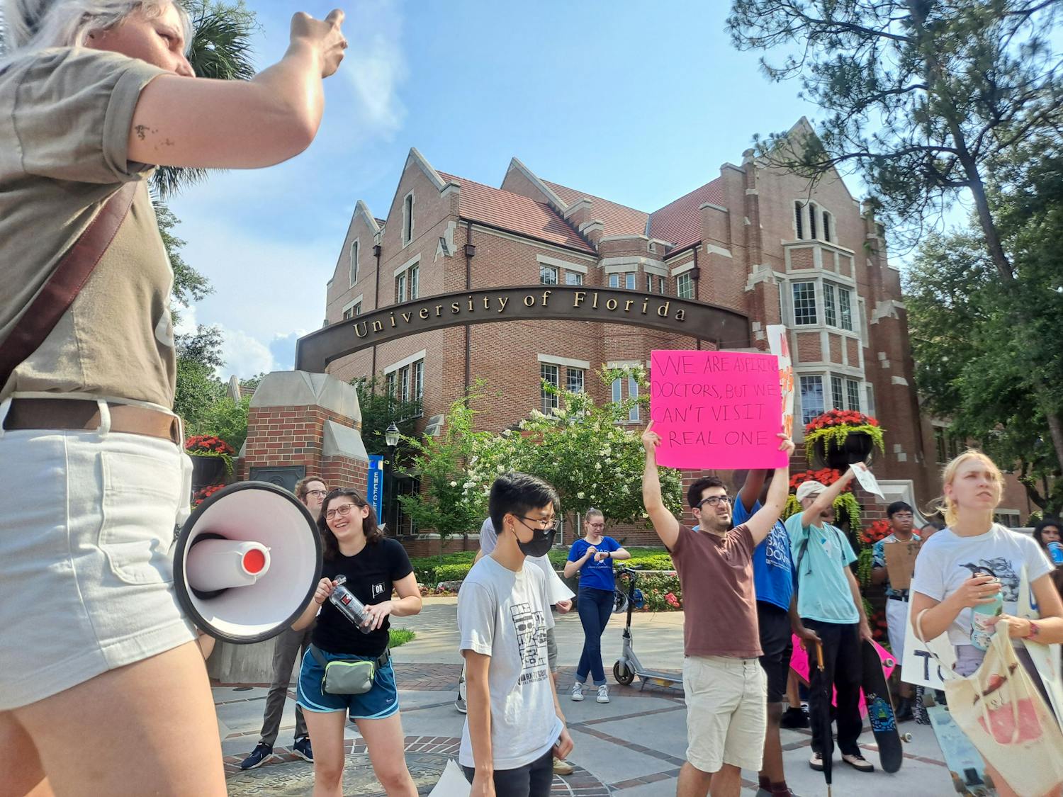About 50 graduate students marched from the Reitz Union to Tigert Hall Tuesday to protest the proposed increase to graduate assistants&#x27; wages. 