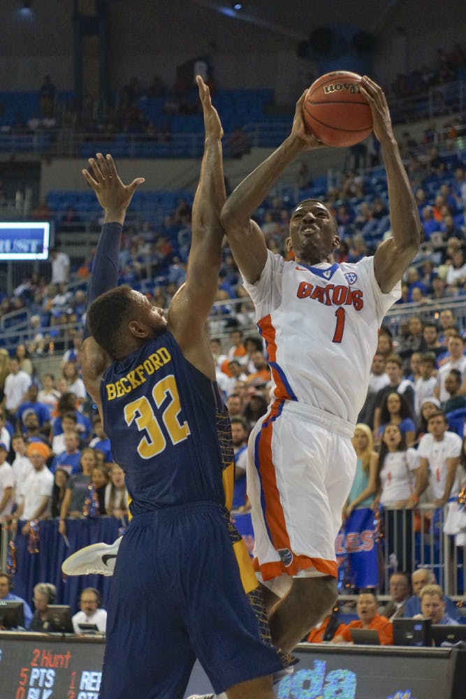 UF swingman Devon Walker jumps for a layup during the second half of Florida's 104-54 win against North Carolina A&amp;T on Nov. 16, 2015, in the O'Connell Center.