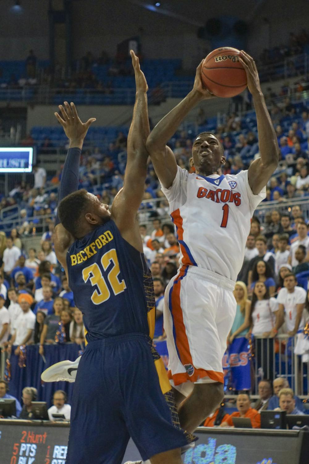 <p>UF swingman Devon Walker jumps for a layup during the second half of Florida's 104-54 win against North Carolina A&amp;T on Nov. 16, 2015, in the O'Connell Center.</p>