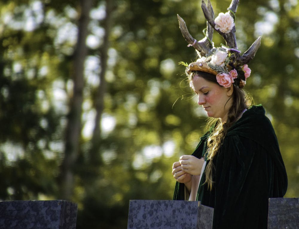 Thieves Guilde actor Ellie Smith, 18, looks down at the chessboard from a prop castle.