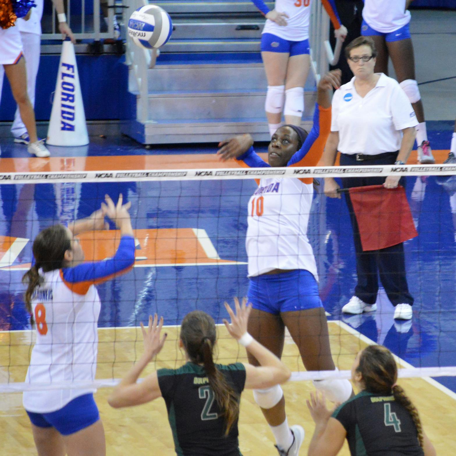 Redshirt senior middle blocker Chloe Mann swings at the ball set to her by senior setter Taylor Brauneis during Florida’s 3-0 victory against Jacksonville on Thursday in the O’Connell Center. Mann had a team-high 15 kills against the Dolphins.