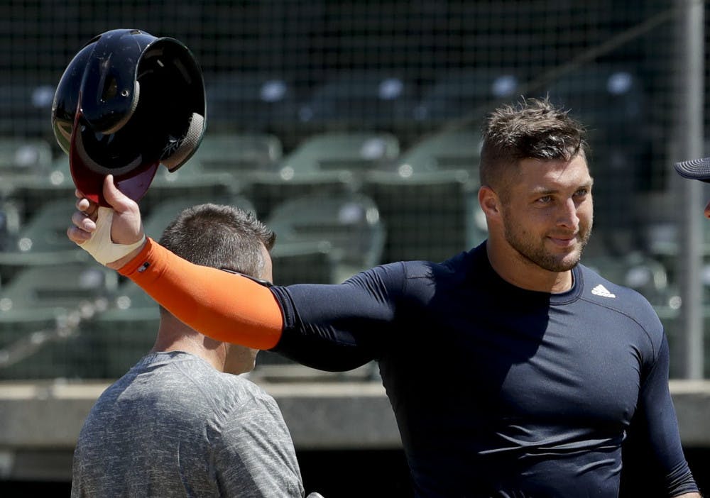 <p>Former NFL quarterback, Tim Tebow finishes his work out for baseball scouts and the media during a showcase on the campus of the University of Southern California, Tuesday, Aug. 30, 2016 in Los Angeles. The Heisman Trophy winner works out for a big gathering of scouts on USC's campus in an attempt to start a career in a sport he hasn't played regularly since high school. (AP Photo/Chris Carlson)</p>