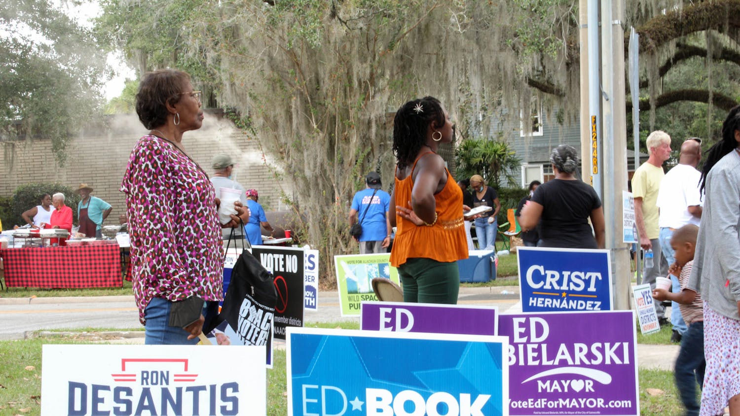 Voters listen to local candidates ﻿speak at the Souls to the Polls event held outside of the Alachua County Supervisor of Elections Office Sunday, Nov. 6, 2022.
