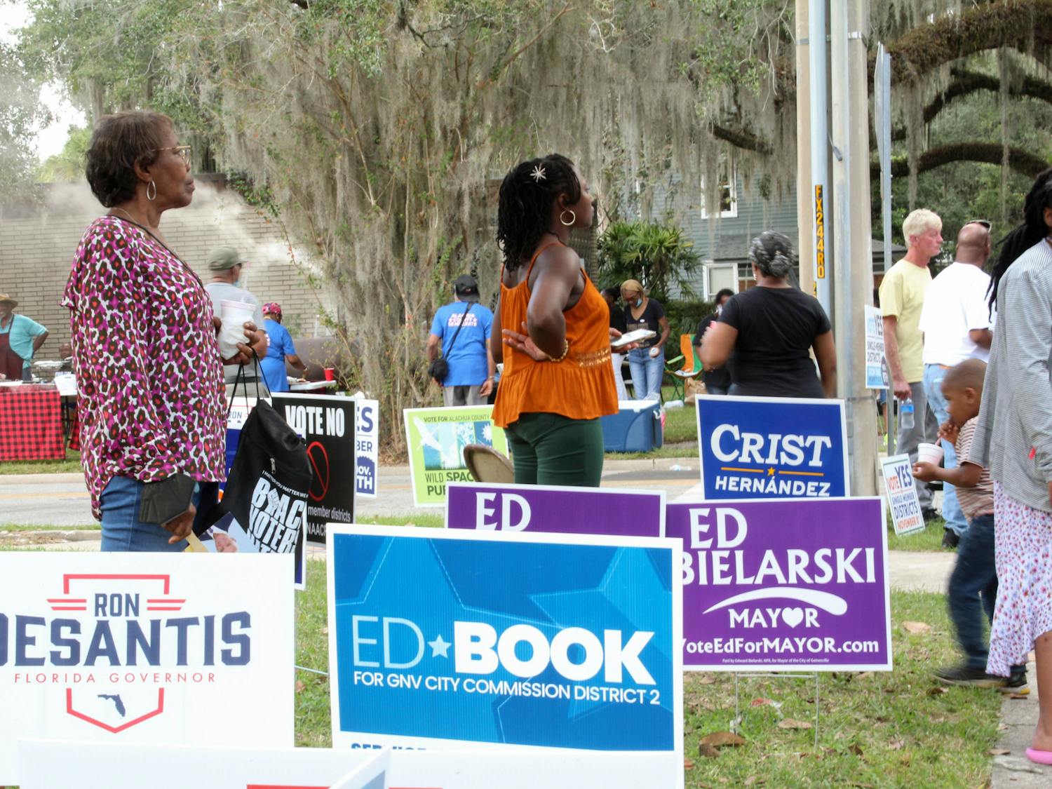 Voters listen to local candidates ﻿speak at the Souls to the Polls event held outside of the Alachua County Supervisor of Elections Office Sunday, Nov. 6, 2022.