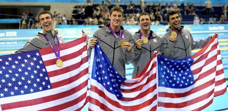 The U.S. men’s 4x200m freestyle relay team poses with its gold medals after the race Tuesday in London. Former Gators Conor Dwyer (middle left) and Ryan Lochte (middle right) helped Michael Phelps (far left) earn his 15th gold medal and record-breaking 19th Olympic medal.