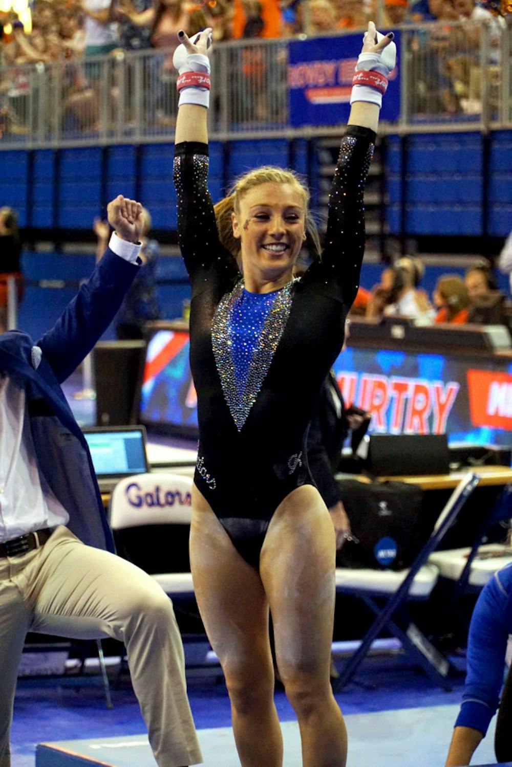 <p>Alex McMurtry poses after finishing a routine during Florida's win against North Carolina on March 11, 2016, in the O'Connell Center.</p>