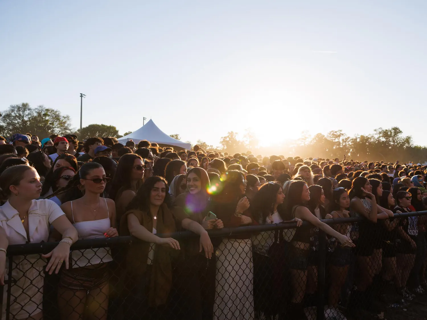University of Florida students wait for the next song during SwampFest on Flavet Field, Tuesday, April 14, 2026, in Gainesville, Fla.