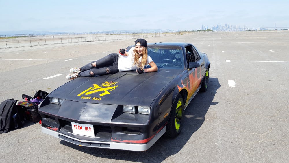 <p><span id="docs-internal-guid-29aba499-8bb9-a963-201f-c4fd3ad35554"><span>Tracy Fanara, a 32-year-old UF alumna, sits on top of her team’s car in the first episode of the Science Channel’s new show “MythBusters: The Search.” She is one of 10 contestants on the show.</span></span></p>