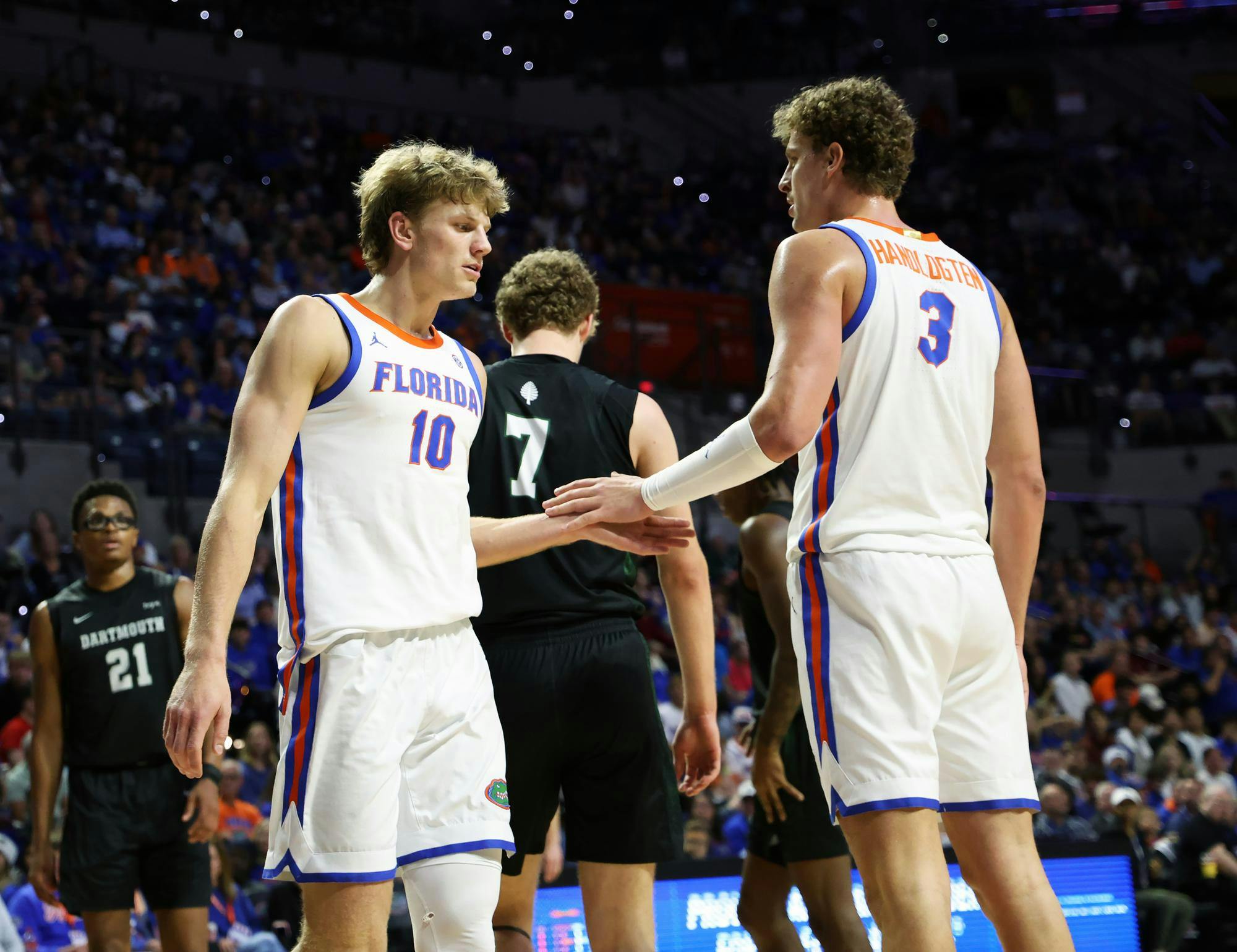 Florida forward Thomas Haugh (left) and Florida center Micah Handlogten (right) share a handshake during Florida’s game against Dartmouth at the O’Connell Center on Monday, Dec. 29, 2025.