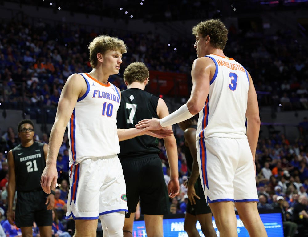 Florida forward Thomas Haugh (left) and Florida center Micah Handlogten (right) share a handshake during Florida’s game against Dartmouth at the O’Connell Center on Monday, Dec. 29, 2025.