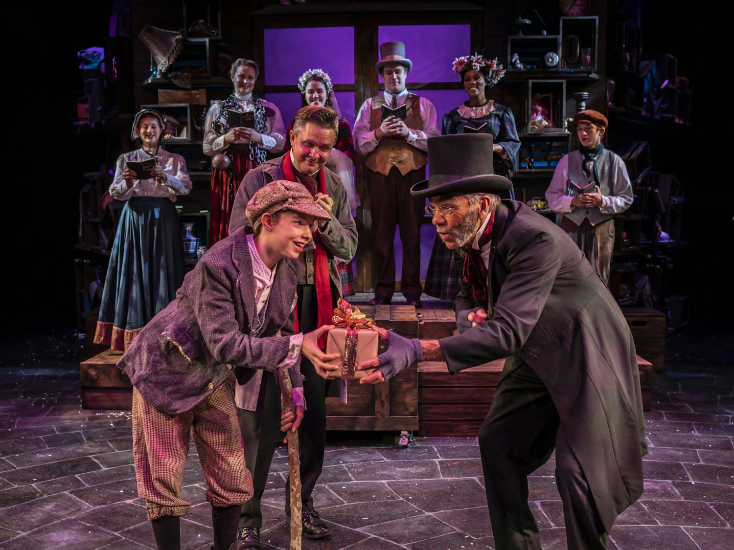 Actors from The Hippodrome are seen on stage for A Christmas Carol. 
