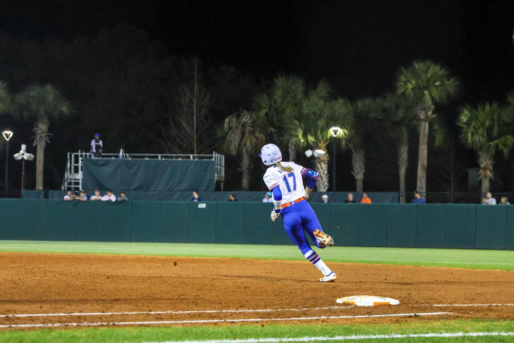 Shortstop Skylar Wallace rounds first base in an 11-0 victory against the Jacksonville Dolphins, Wednesday, Feb. 15, 2023.