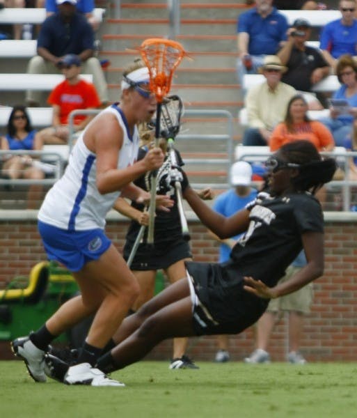 Florida freshman midfielder Nicole Graziano checks Vanderbilt’s Brandi Byner during Saturday’s 17-5 win against the Commodores.