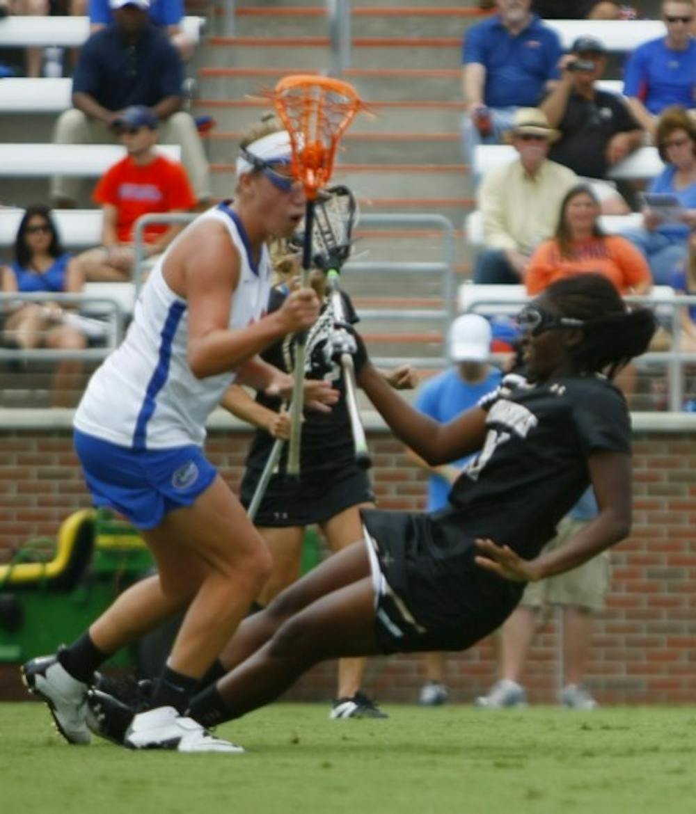 <p class="p1">Florida freshman midfielder Nicole Graziano checks Vanderbilt’s Brandi Byner during Saturday’s 17-5 win against the Commodores.</p>