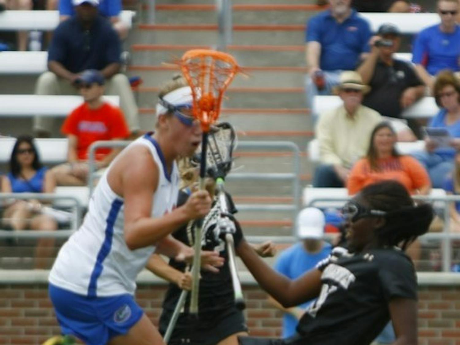 Florida freshman midfielder Nicole Graziano checks Vanderbilt’s Brandi Byner during Saturday’s 17-5 win against the Commodores.