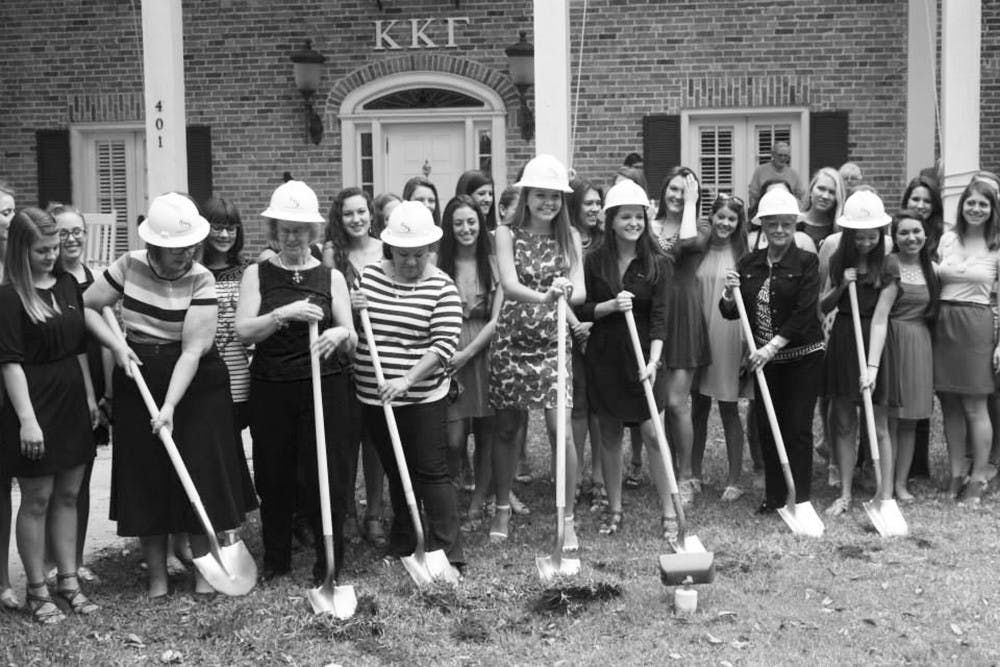 Members of Kappa Kappa Gamma break ground on their new house expansion Sunday afternoon. The renovations, which include an additional laundry room, are scheduled to be completed by Fall. 