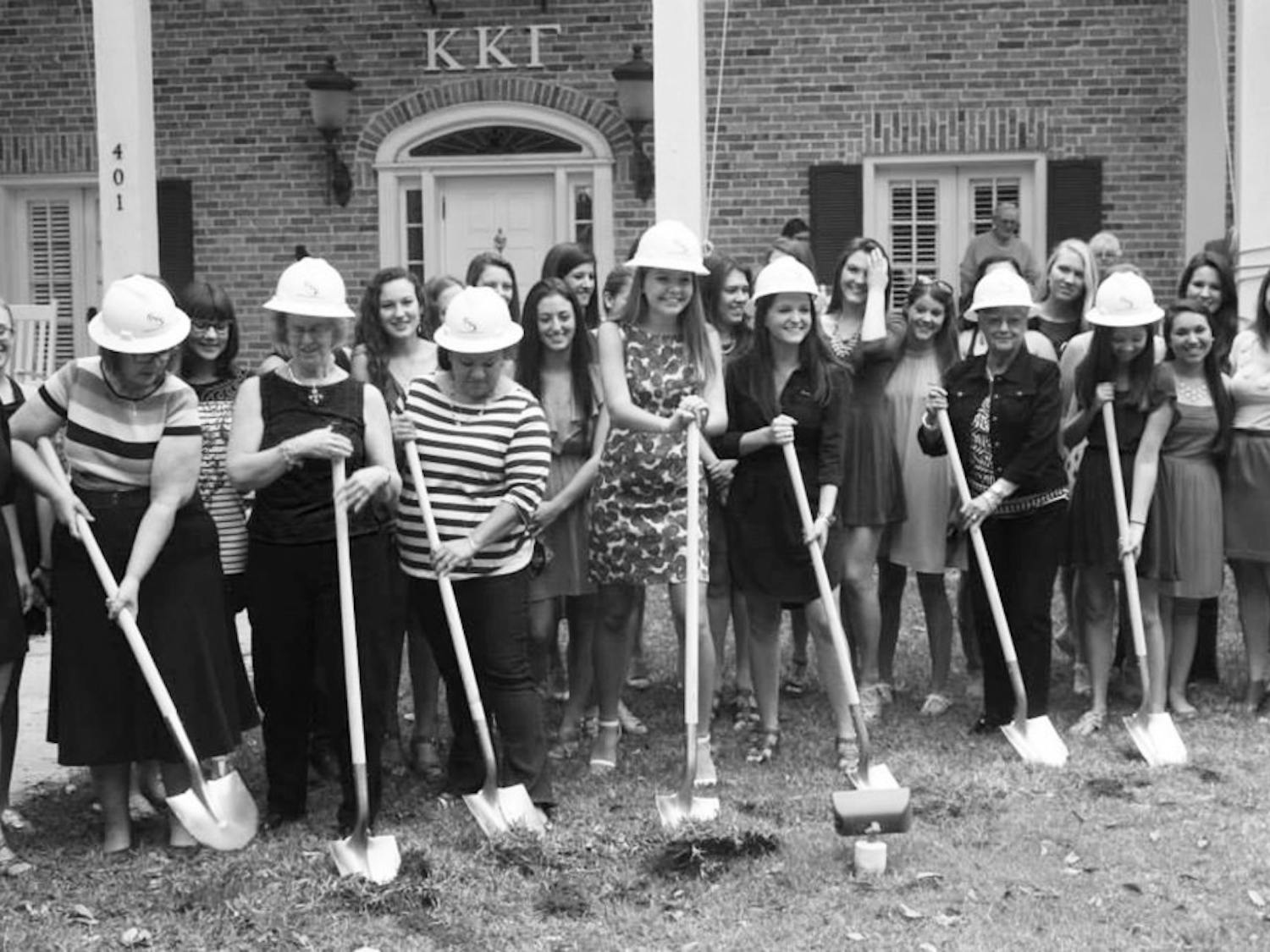 Members of Kappa Kappa Gamma break ground on their new house expansion Sunday afternoon. The renovations, which include an additional laundry room, are scheduled to be completed by Fall. 