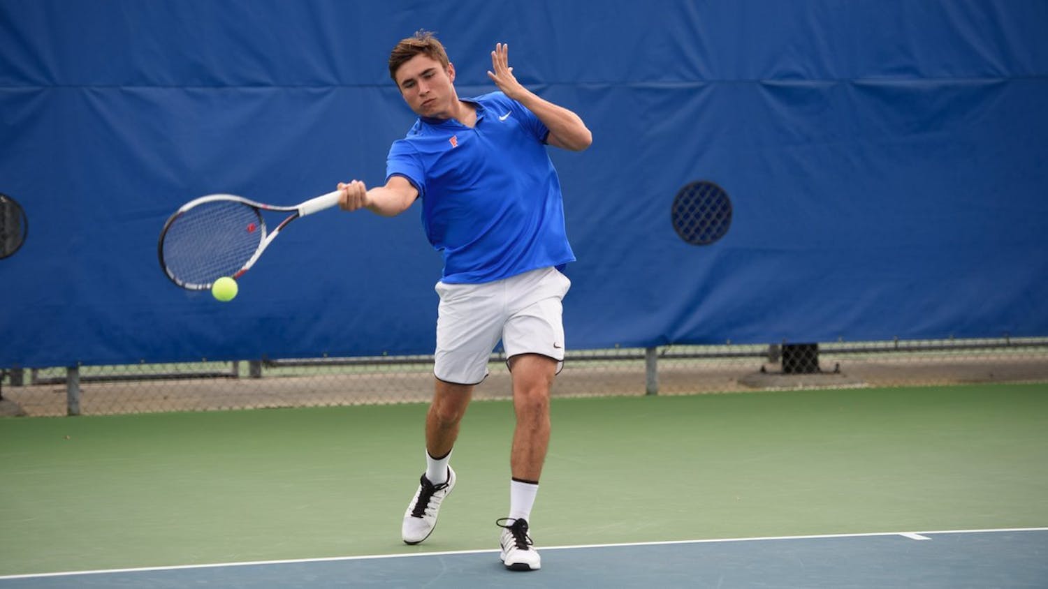 Stephen Madonia hits a forehand during the 2016-17 Florida men’s tennis regular season at the Ring Tennis Complex.