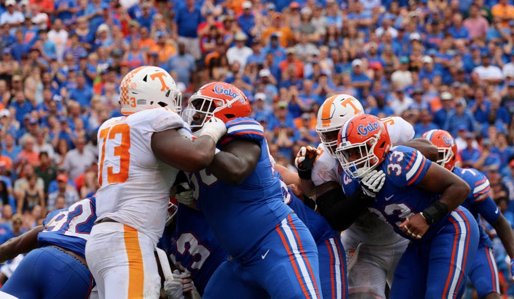 <p>Defensive lineman Tedarrell Slaton tries to get past a Tennessee offensive lineman during Florida's 26-20 win against the Volunteers on Sept. 16, 2017, at Ben Hill Griffin Stadium.</p>