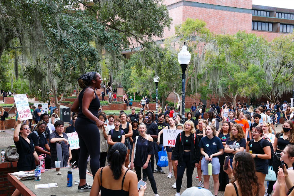 <p>Kariel Stuart rallies students in Turlington Plaza to &quot;mourn the Earth&quot; in protest of climate change Friday, Sept. 23, 2022. </p>