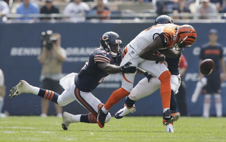 Cincinnati Bengals wide receiver A.J. Green (18) fumbles the ball as he is tackled by Chicago Bears strong safety Major Wright (21) and cornerback Tim Jennings on Sept. 8 at Soldier Field.&nbsp;