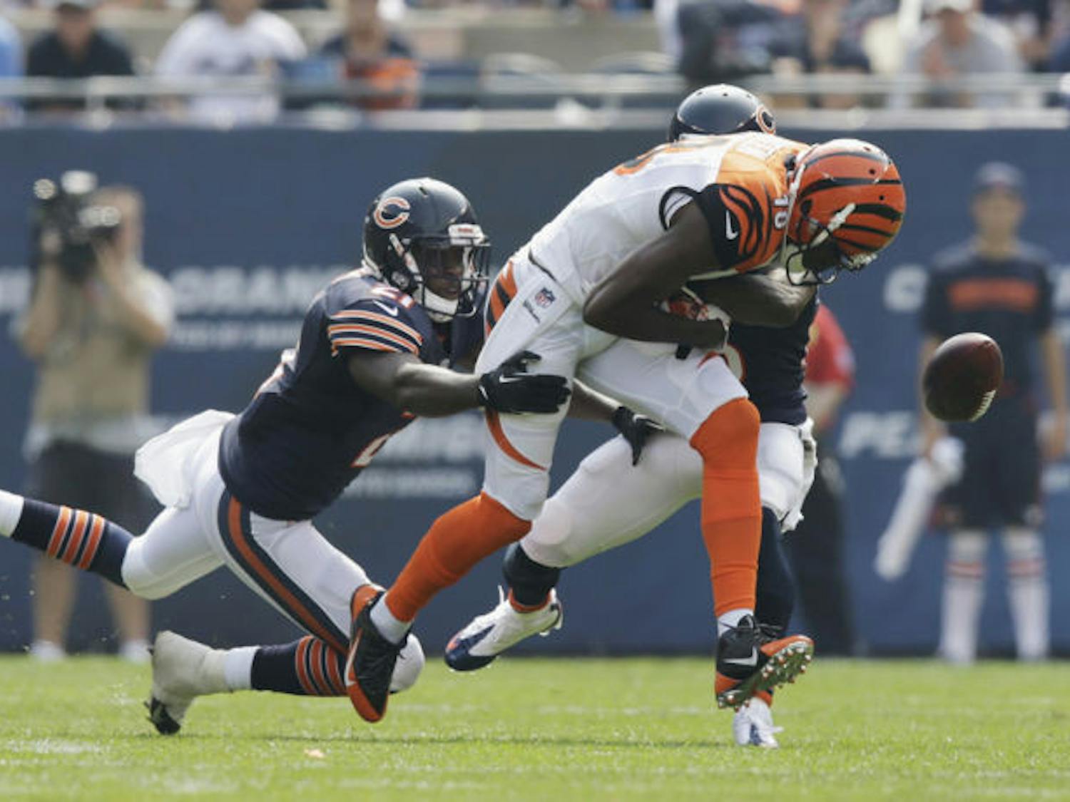 Cincinnati Bengals wide receiver A.J. Green (18) fumbles the ball as he is tackled by Chicago Bears strong safety Major Wright (21) and cornerback Tim Jennings on Sept. 8 at Soldier Field.&nbsp;